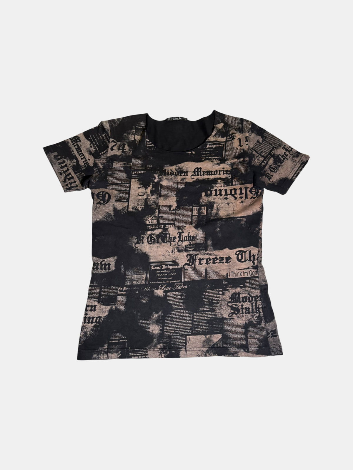 in the attic Newspaper Print T-Shirt