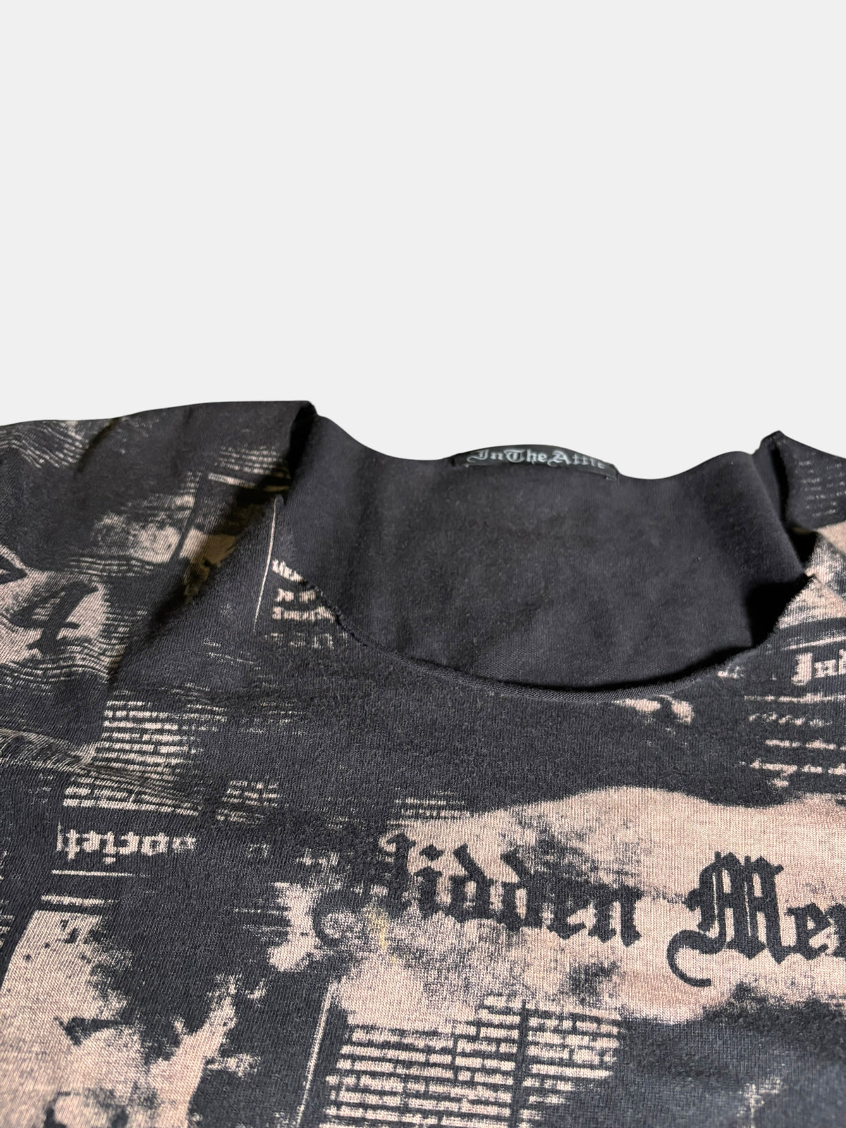 in the attic Newspaper Print T-Shirt