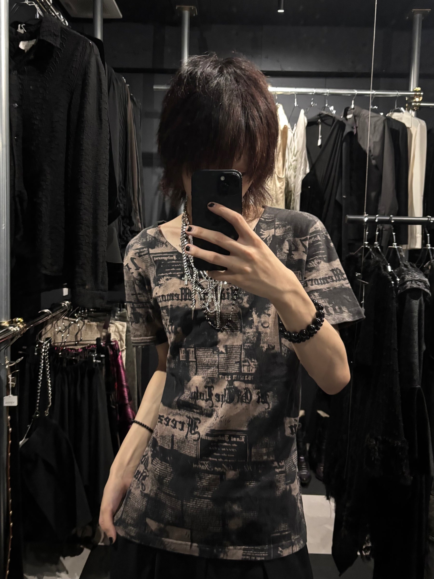 in the attic Newspaper Print T-Shirt